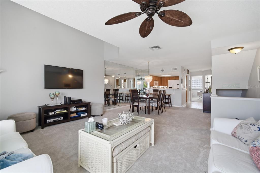 643 Garland Circle Indian Rocks Beach, FL 33785 - Photo 15 of 81 a living room with furniture and a flat screen tv
