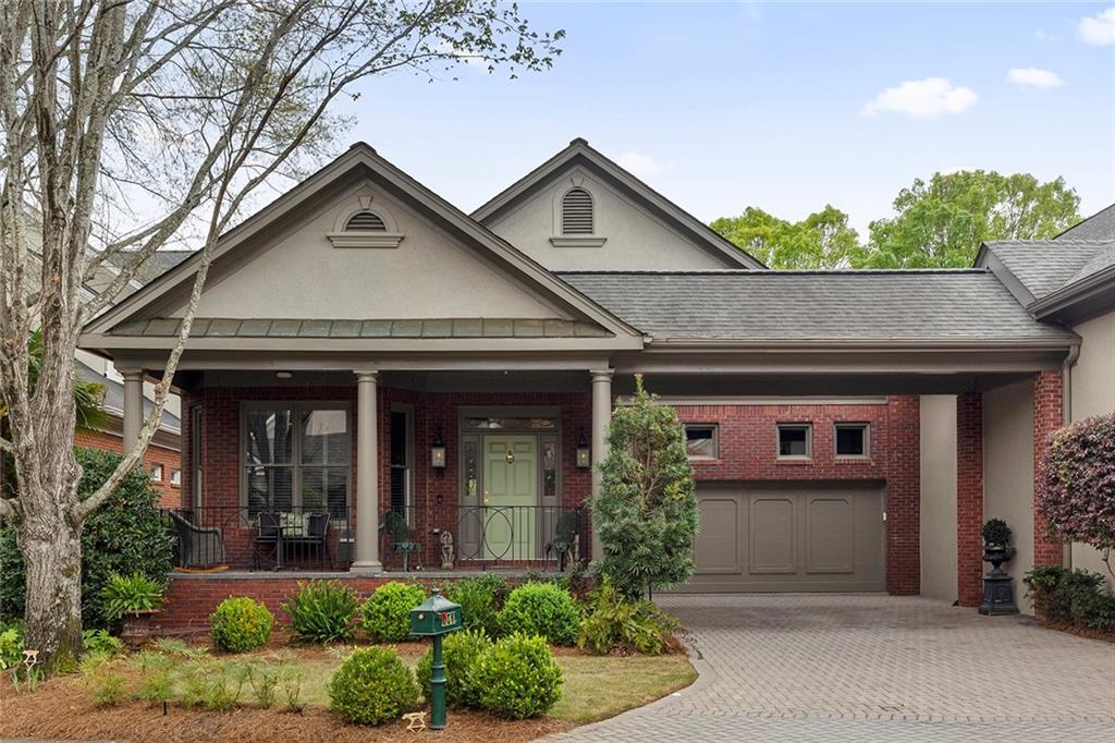 front view of a house with potted plants