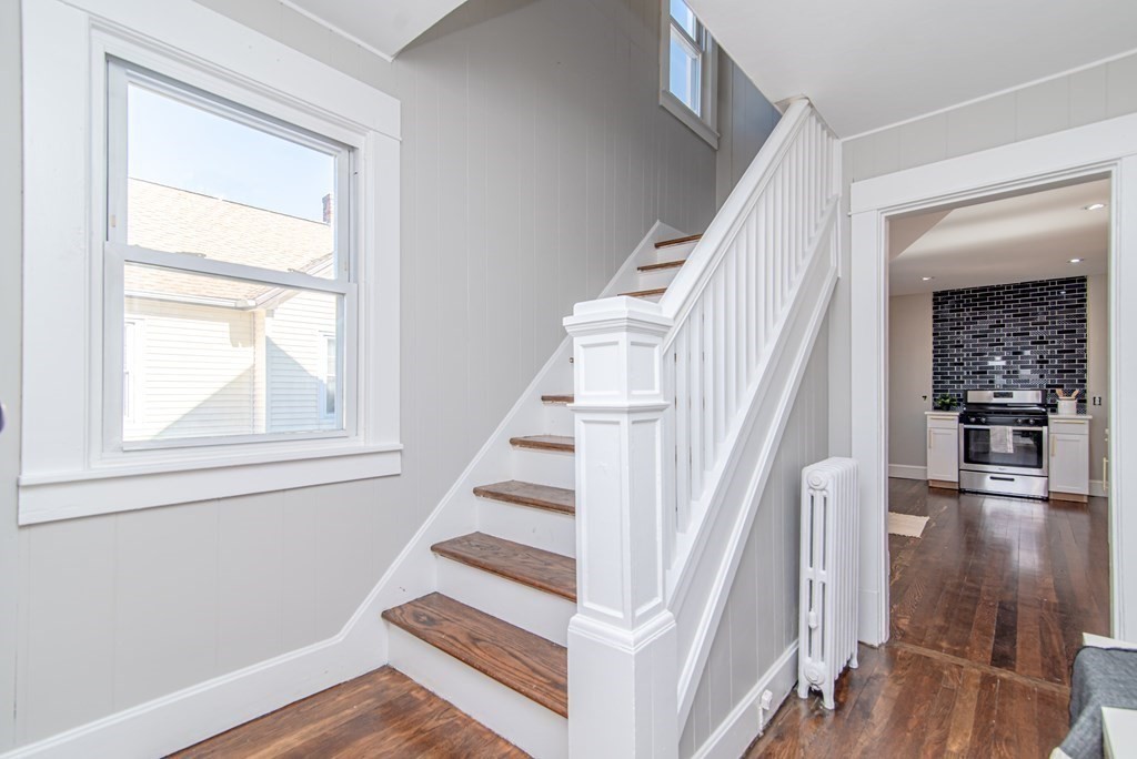 91 Wilber Street Springfield, MA 01104 - Photo 10 of 24 a view of staircase with white walls and windows