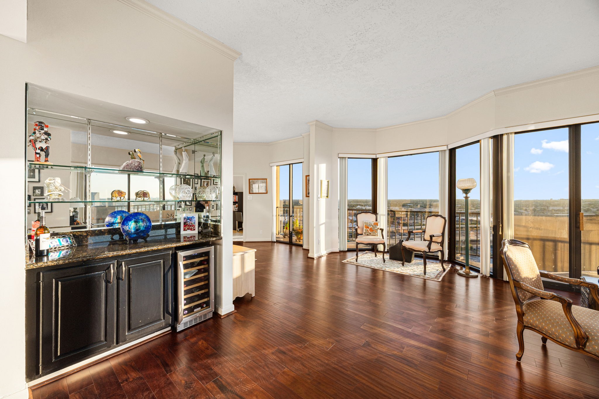 3350 McCue Road, Unit 2302 Houston, TX 77056 - Photo 10 of 35 Spacious secondary sitting area between living and dining, or use this area as a great home office with the sky as your background. Gleaming engineered hardwood floors throughout living, dining and entry.
