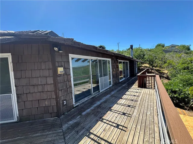 a view of livingroom and hallway with wooden floor