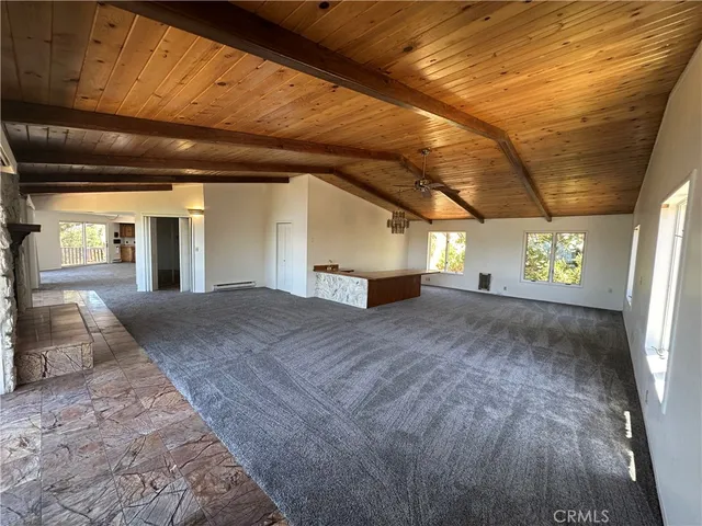a view of an empty room with a fireplace