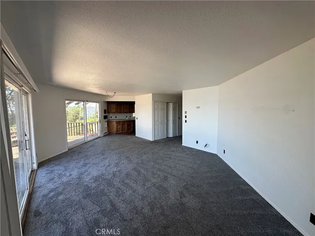 a kitchen that has a sink and a stove in it