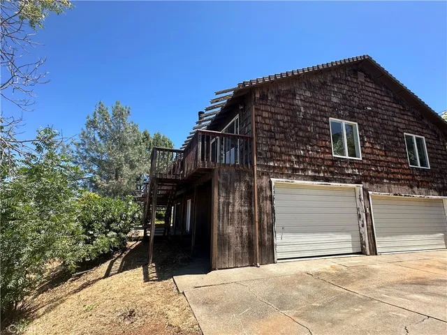 a view of balcony with wooden floor and city view
