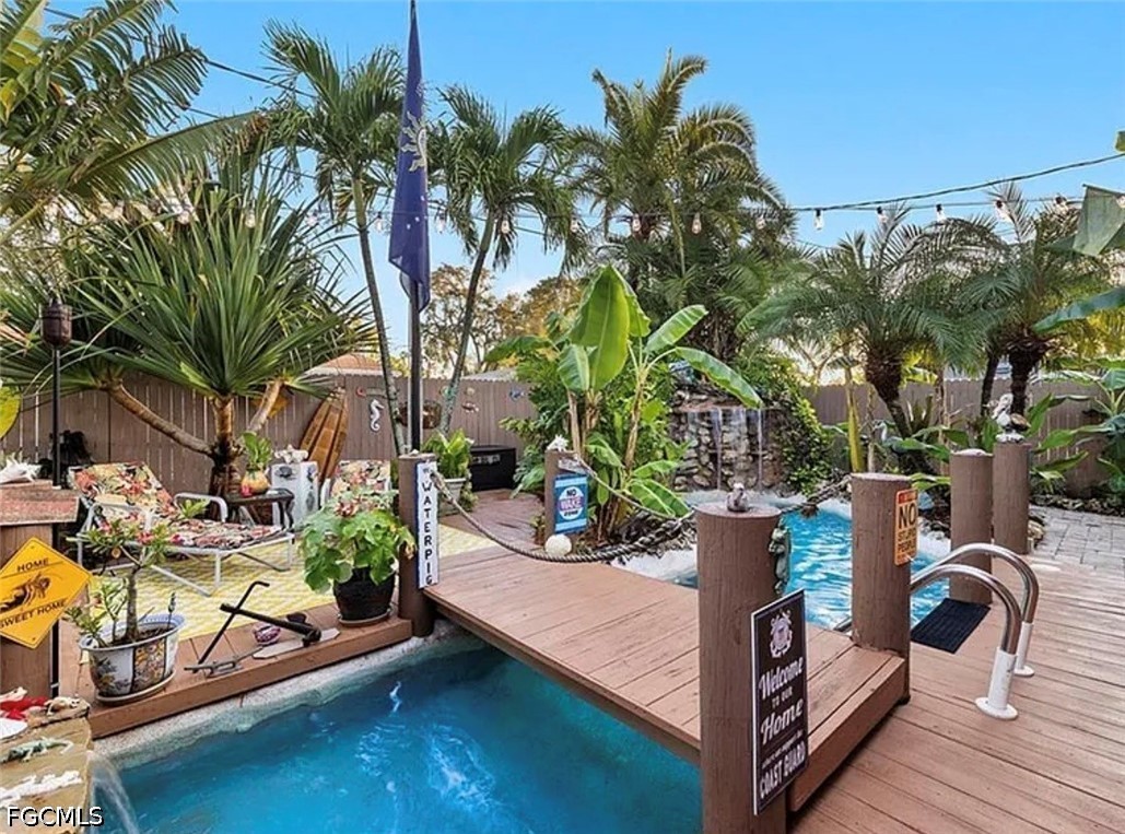 1535 Ransom Street Fort Myers, FL 33901 - Photo 3 of 4 a view of a swimming pool with a patio and plants