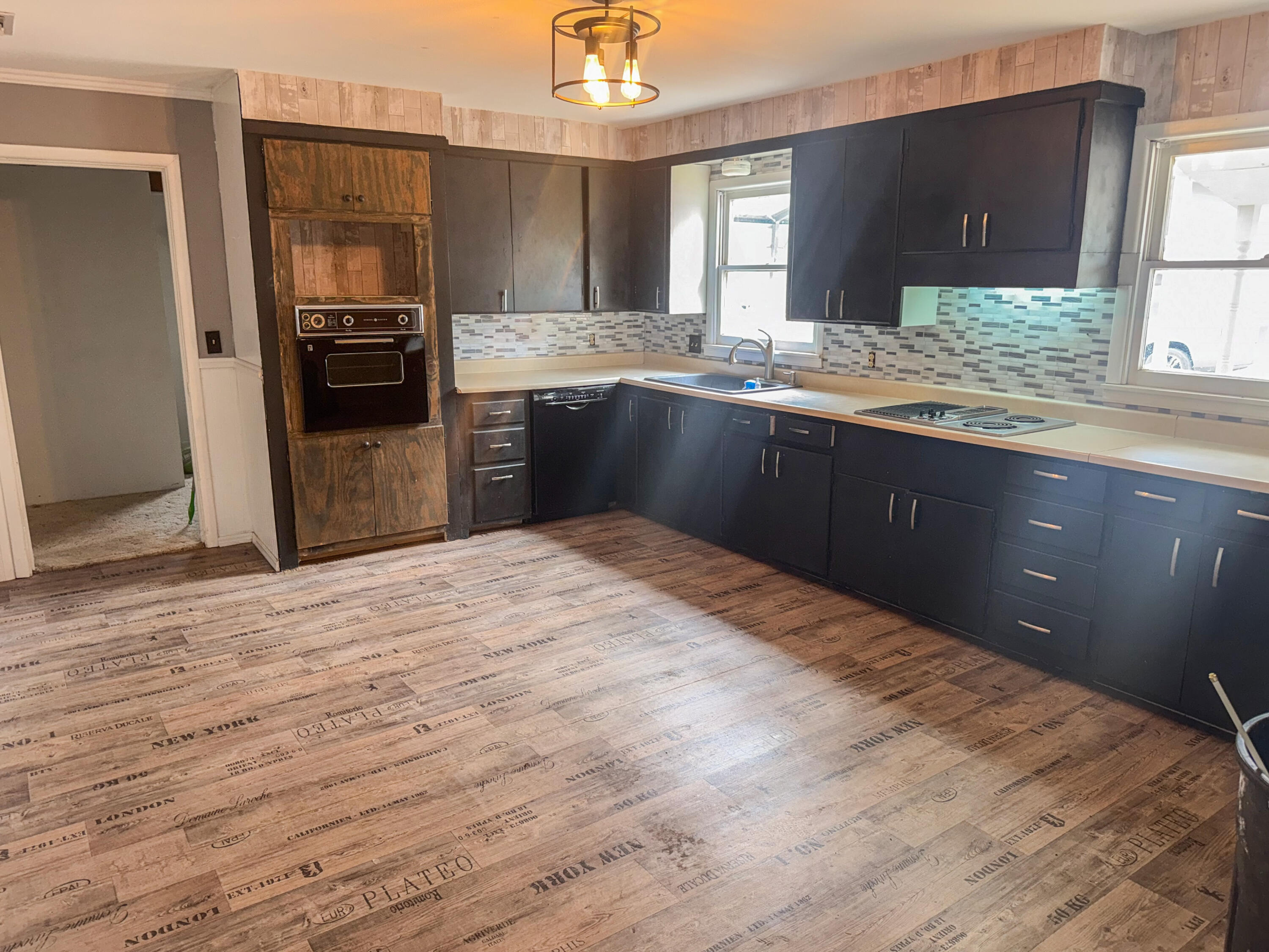 601 Northeast 3rd Street Earth, TX 79031 - Photo 5 of 8 a kitchen with stainless steel appliances granite countertop a refrigerator and a stove top oven