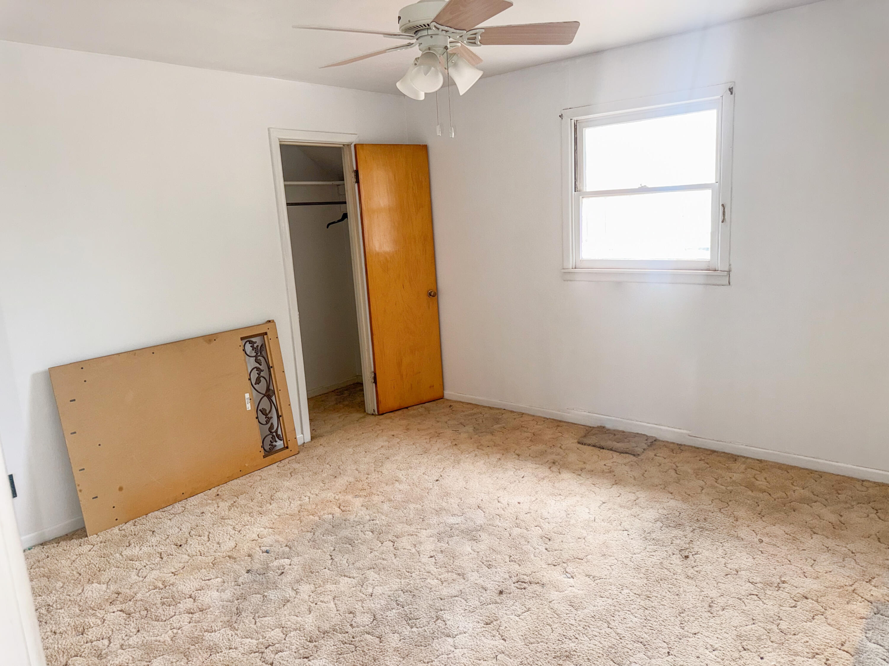 601 Northeast 3rd Street Earth, TX 79031 - Photo 7 of 8 an empty room with windows and closet