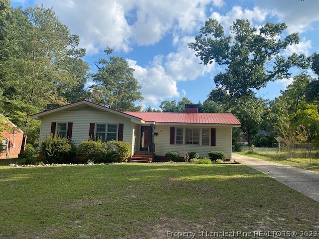 1811 Lyon Road Fayetteville, NC 28303 - Photo 1 of 27 a front view of house with yard and green space