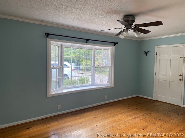 1811 Lyon Road Fayetteville, NC 28303 - Photo 26 of 27 a view of an empty room with wooden floor and a window