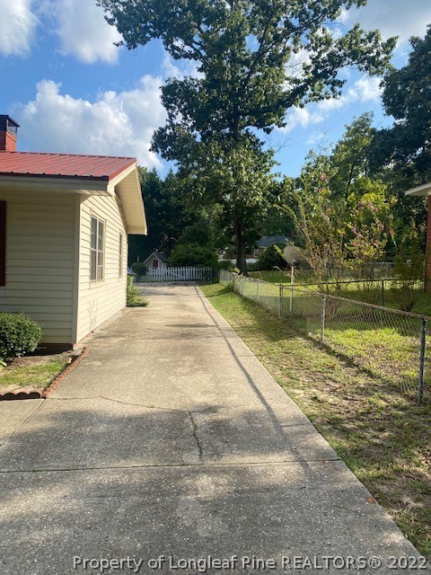 1811 Lyon Road Fayetteville, NC 28303 - Photo 4 of 27 a view of a yard with swimming pool