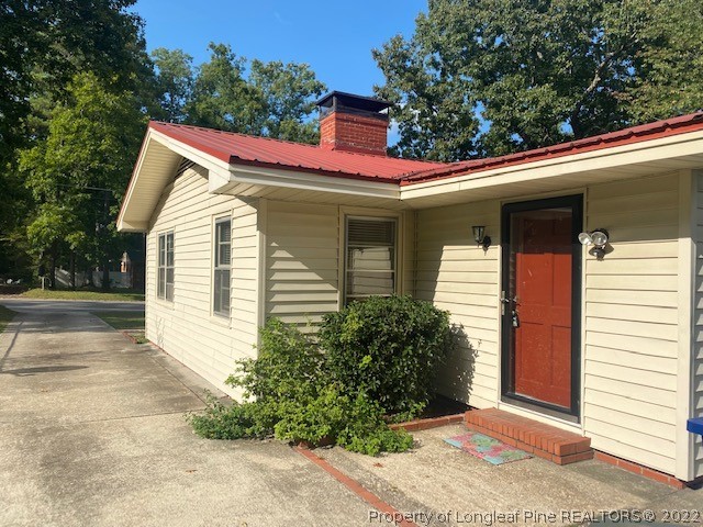 1811 Lyon Road Fayetteville, NC 28303 - Photo 5 of 27 a view of a house with a yard