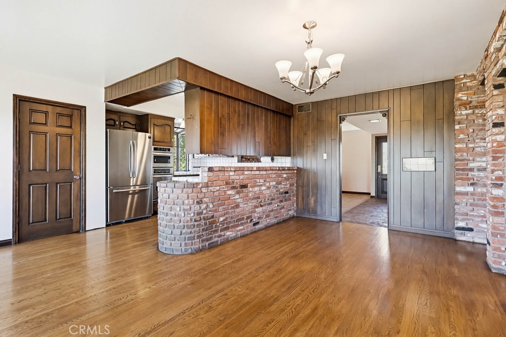 2141 Ronsard Road Rancho Palos Verdes, CA 90275 - Photo 14 of 69 a kitchen with stainless steel appliances granite countertop a refrigerator oven a sink dishwasher and a stove with wooden floor