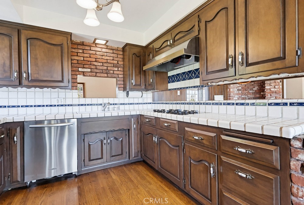 2141 Ronsard Road Rancho Palos Verdes, CA 90275 - Photo 22 of 69 a kitchen with stainless steel appliances granite countertop a sink and cabinets