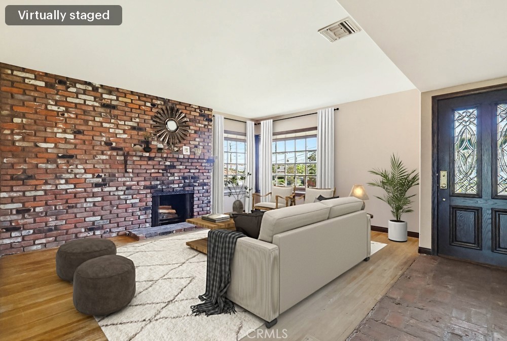 2141 Ronsard Road Rancho Palos Verdes, CA 90275 - Photo 4 of 69 a living room with furniture a fireplace and a floor to ceiling window