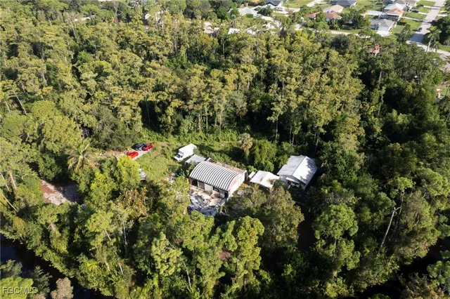 a view of a house with a tree