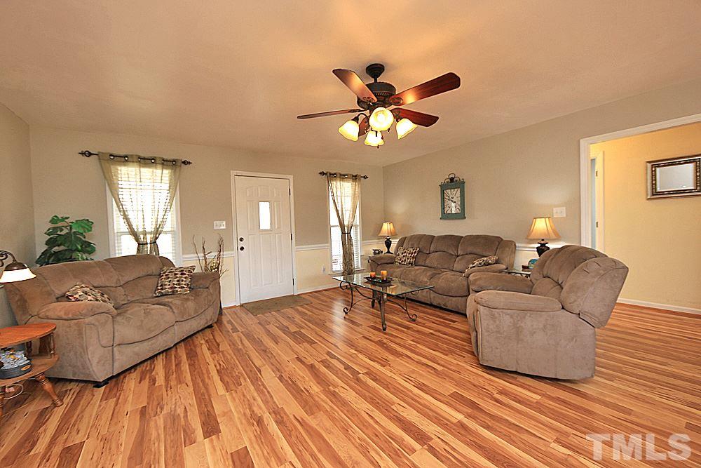 263 Rosa Circle Willow Spring, NC 27592 - Photo 3 of 24 a living room with furniture and a wooden floor