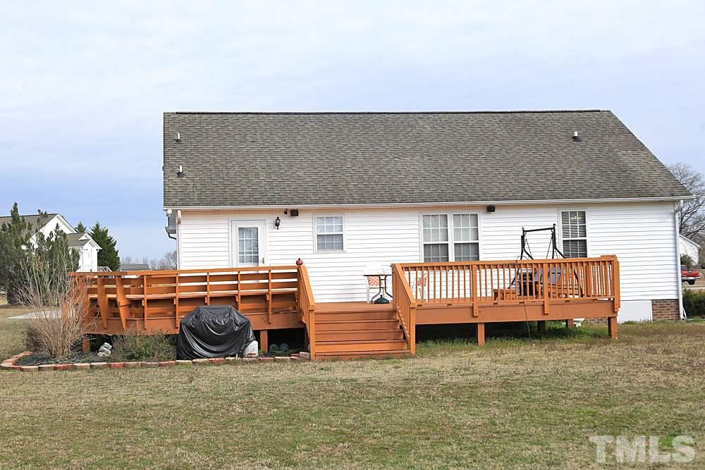 263 Rosa Circle Willow Spring, NC 27592 - Photo 22 of 24 a backyard of a house with outdoor seating