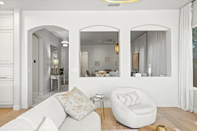 a living room with furniture and a table