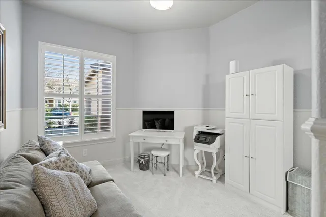 a bedroom with furniture and a window