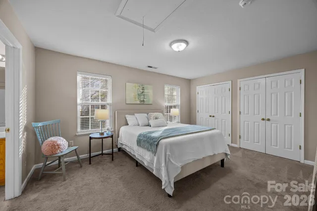 a bed room with a bed and a window