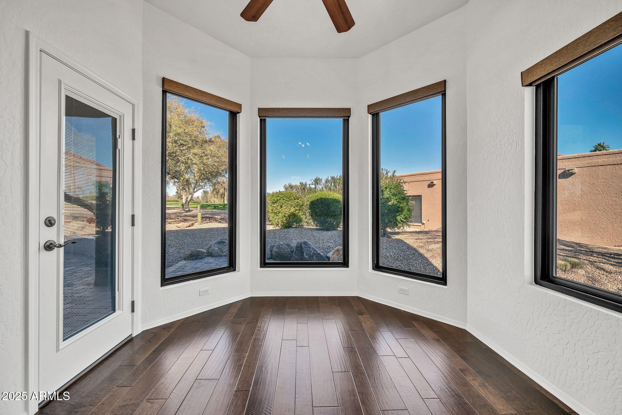 19002 East Alondra Way Rio Verde, AZ 85263 - Photo 12 of 62 a view of a room with wooden floor and windows