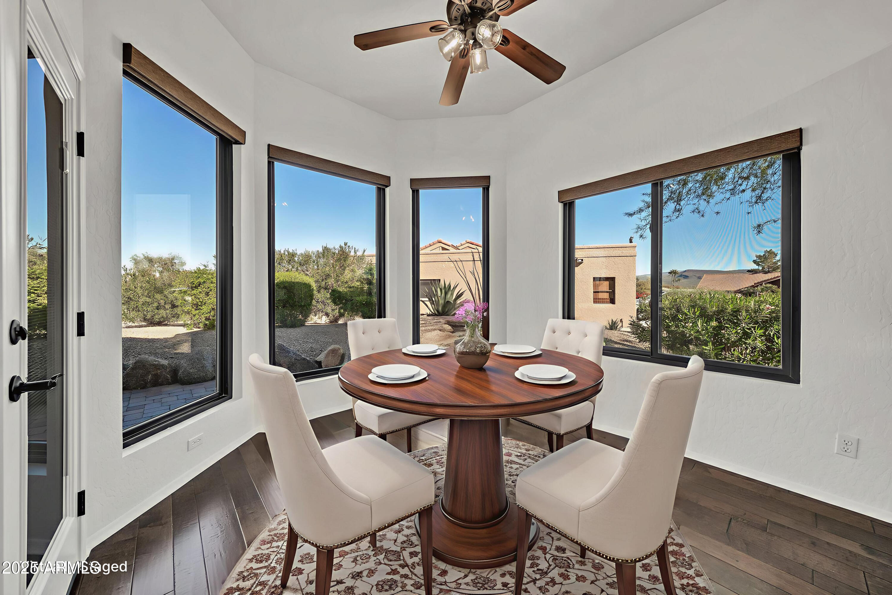 19002 East Alondra Way Rio Verde, AZ 85263 - Photo 14 of 62 a view of a dining room with furniture window and wooden floor