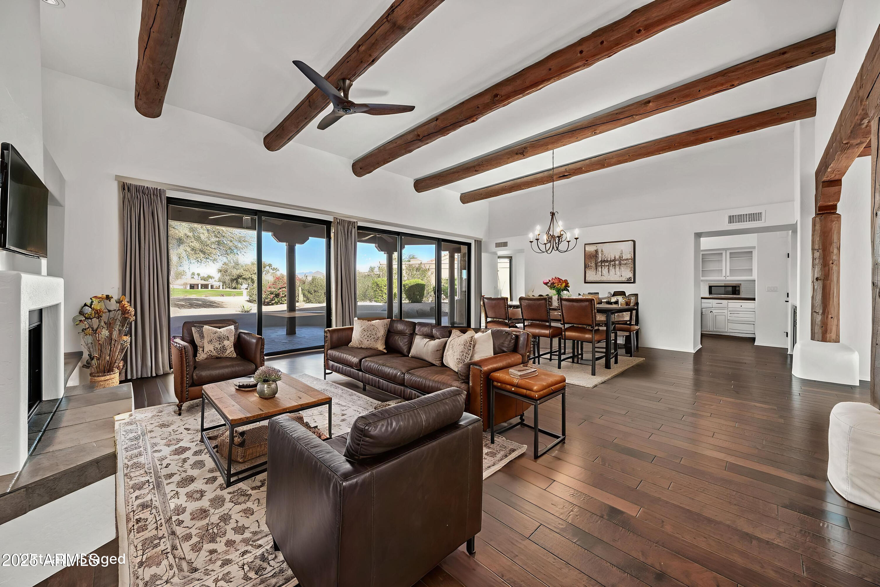 19002 East Alondra Way Rio Verde, AZ 85263 - Photo 17 of 62 a living room with furniture and a flat screen tv