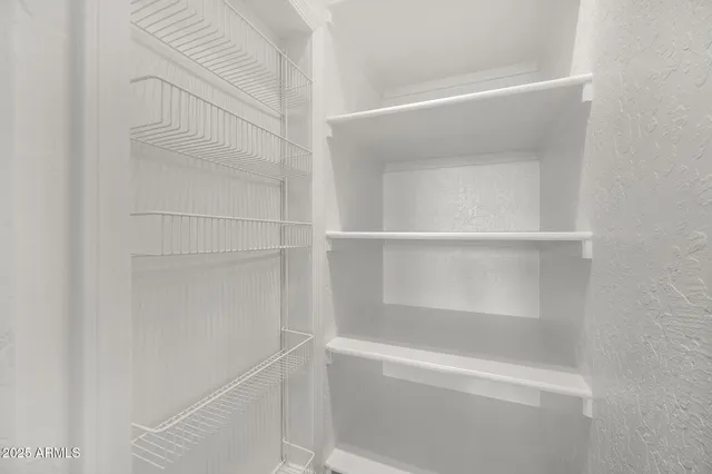 a bath tub sitting in a bathroom next to a window