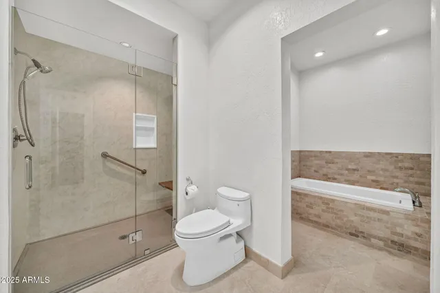 a view of wooden floor and a chandelier fan in a room