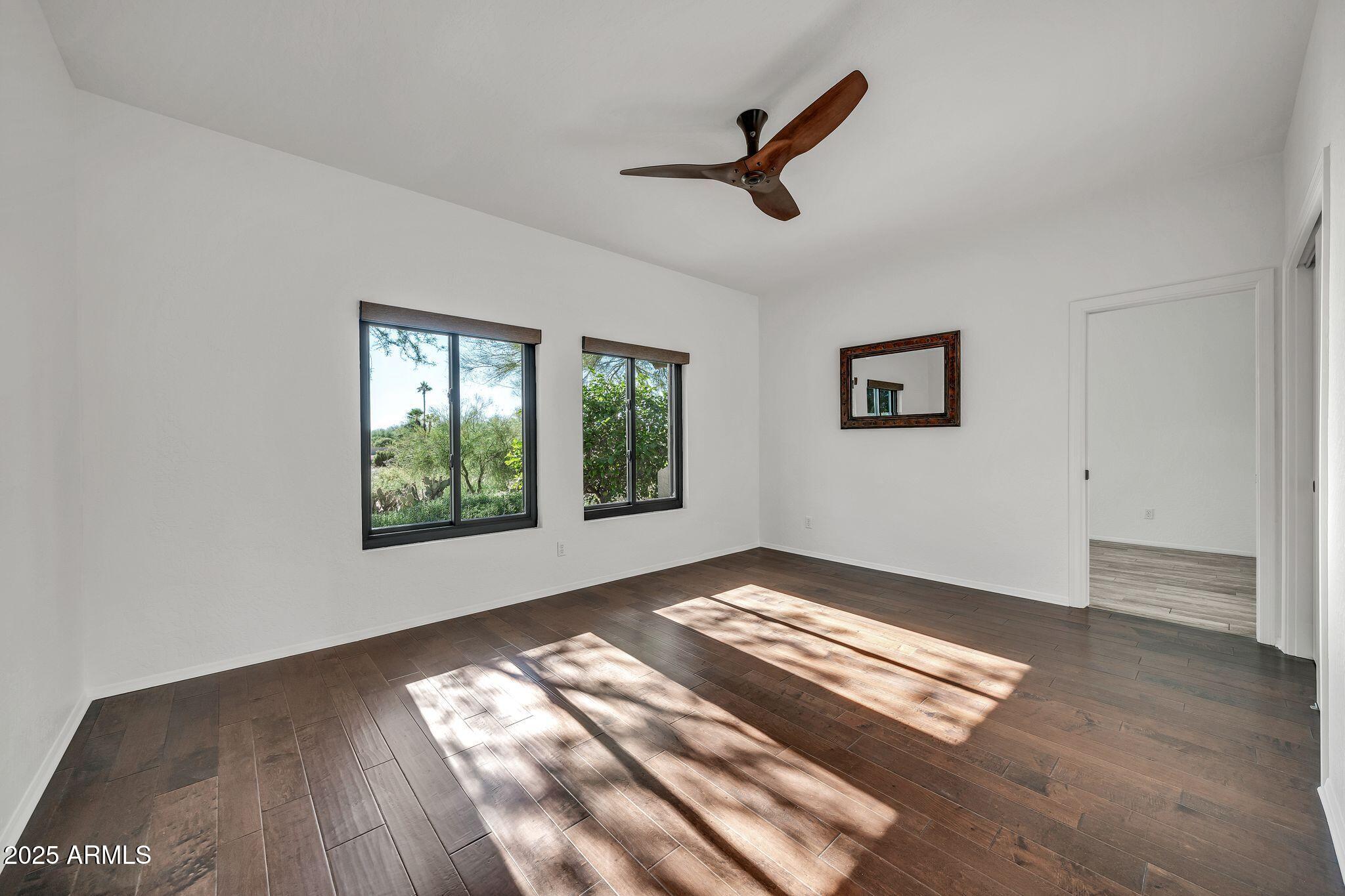 19002 East Alondra Way Rio Verde, AZ 85263 - Photo 47 of 62 a view of empty room with wooden floor and window