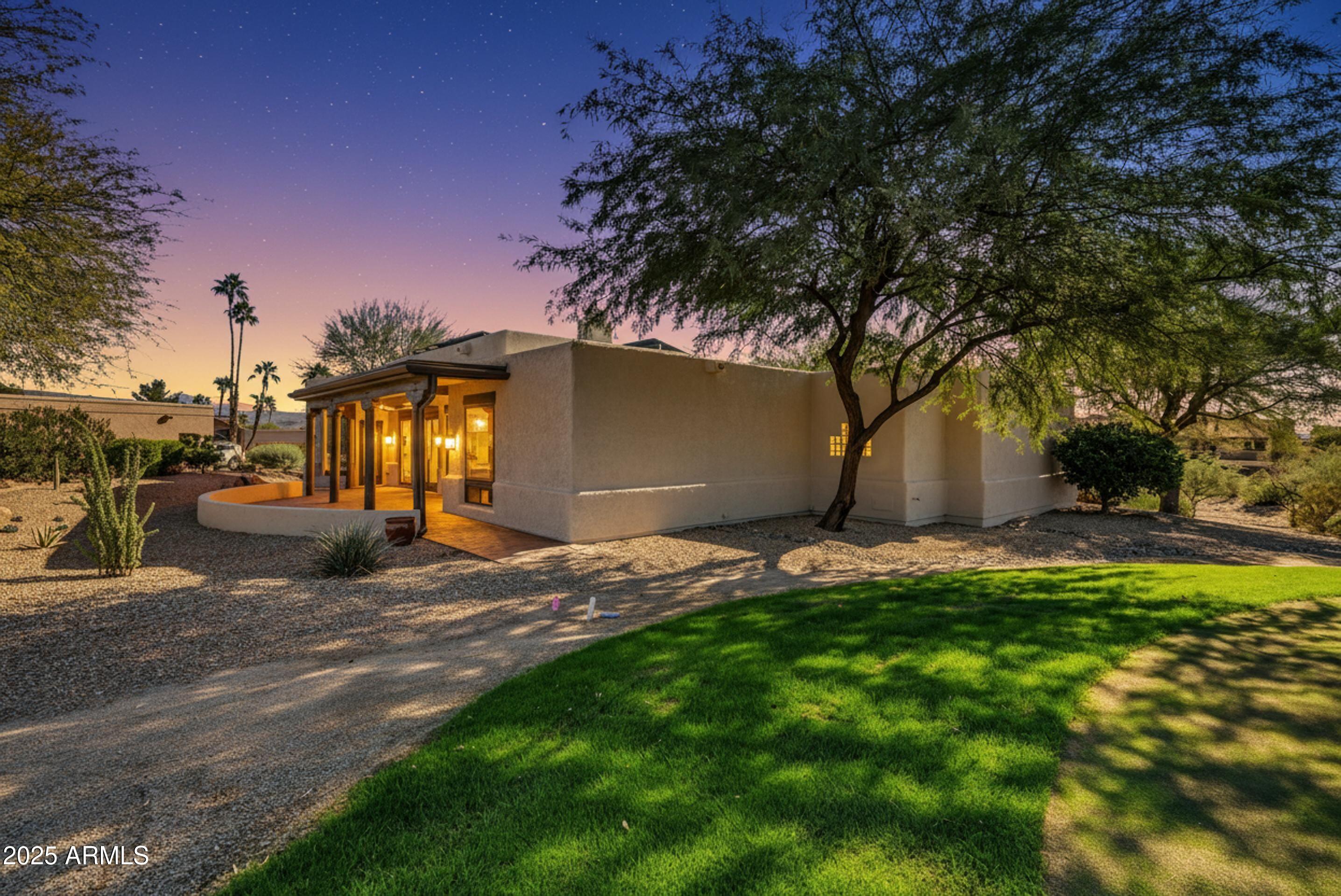 19002 East Alondra Way Rio Verde, AZ 85263 - Photo 4 of 62 a view of a backyard with a fountain