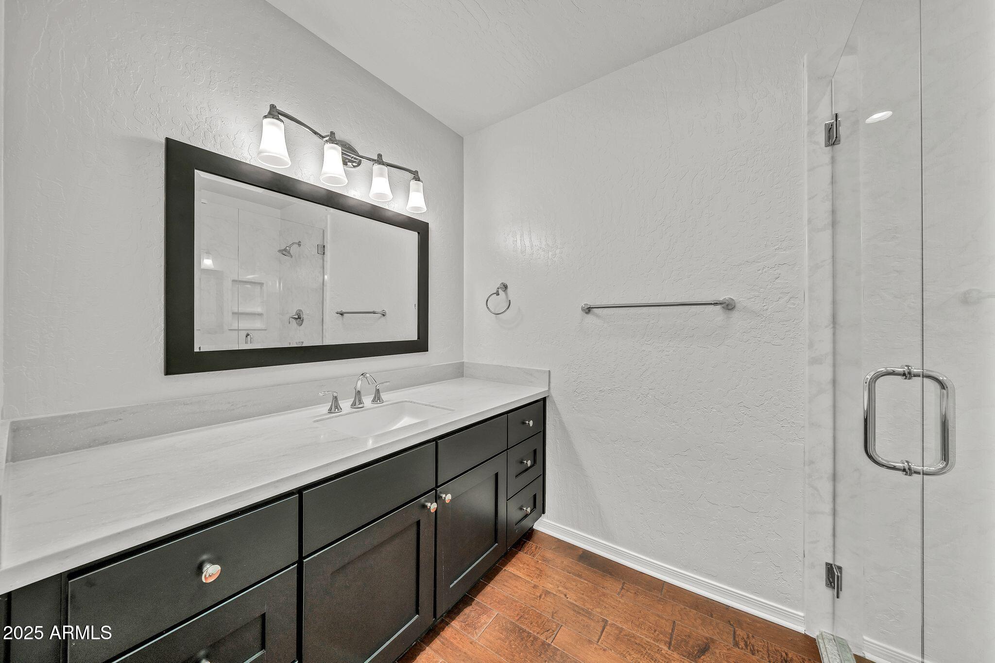 19002 East Alondra Way Rio Verde, AZ 85263 - Photo 50 of 62 a bathroom with a sink vanity and mirror
