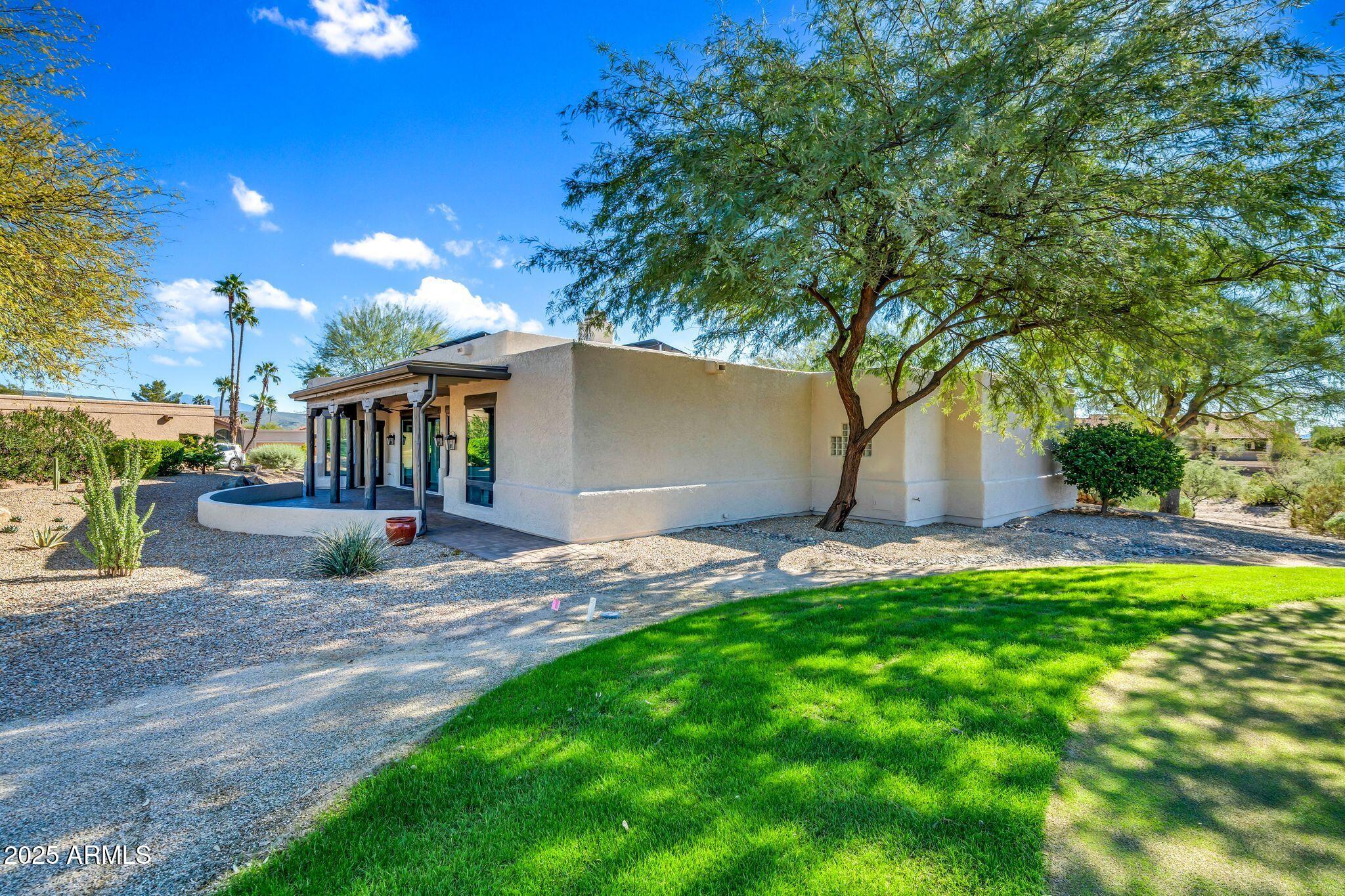 19002 East Alondra Way Rio Verde, AZ 85263 - Photo 56 of 62 a view of a backyard with a garden