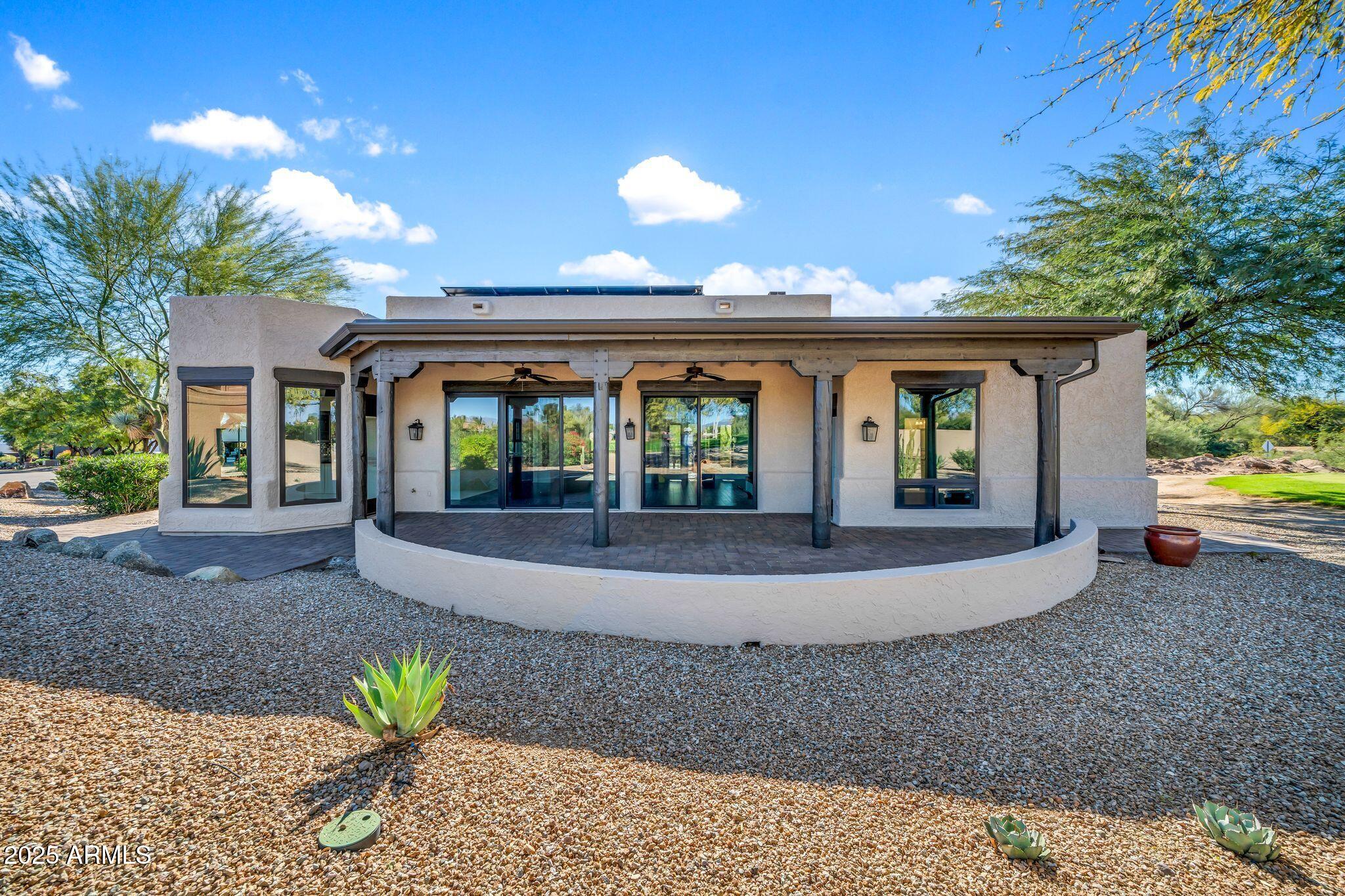 19002 East Alondra Way Rio Verde, AZ 85263 - Photo 57 of 62 a view of a house with a patio and a yard