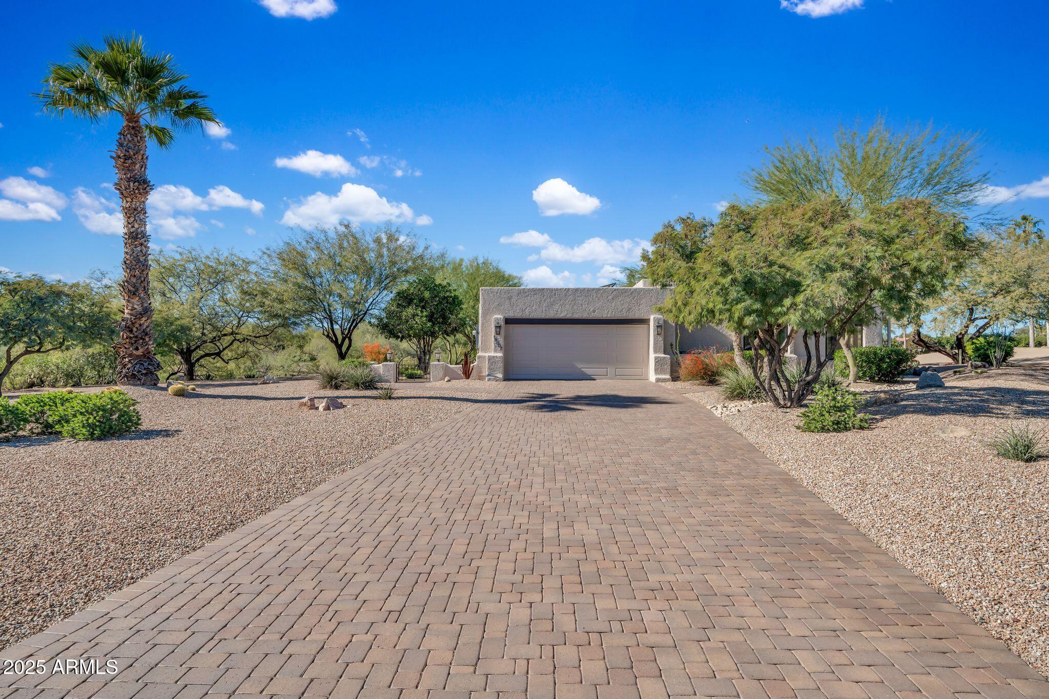 19002 East Alondra Way Rio Verde, AZ 85263 - Photo 6 of 62 a view of a house with a yard and potted plants