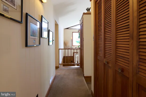 a view of a bathroom from a hallway