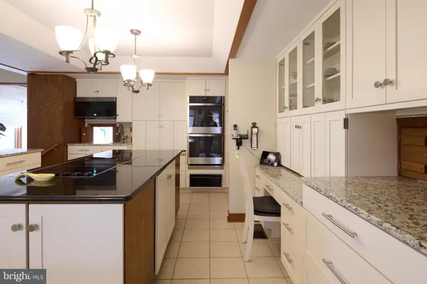 a bedroom with two beds and a window