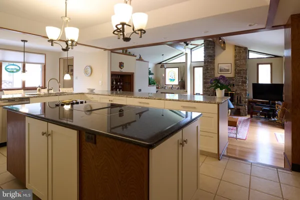 a bedroom with two beds and painting on the wall