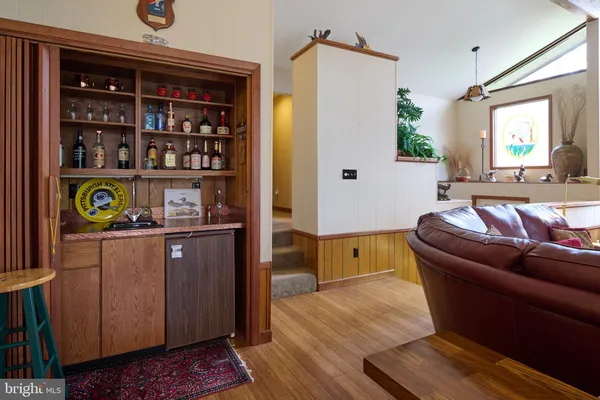 a view of walk in closet with clothes