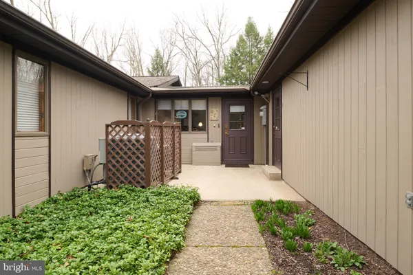 a bathroom with a granite countertop shower and a sink