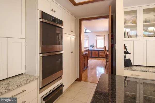 a view of a house with backyard sitting area and garden