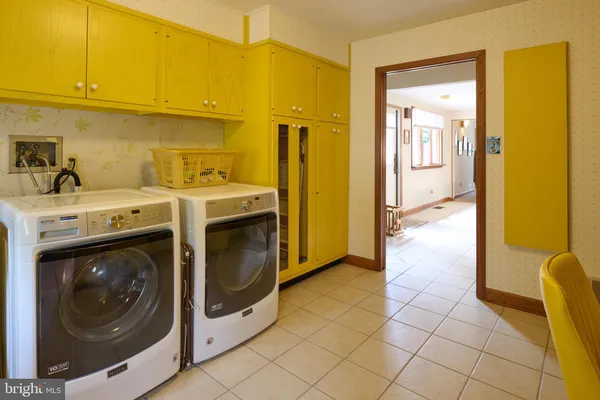 a bedroom with a bed and curtain