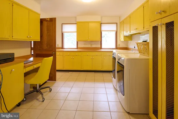 a dining room with furniture window and wooden floor