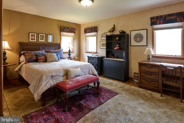 a view of a house with snow in front of it