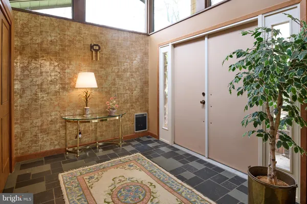 a living room with fireplace furniture and a flat screen tv