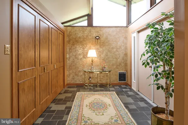 a kitchen that has a sink and a stove in it
