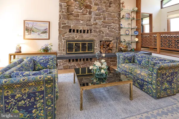 a kitchen with stainless steel appliances wooden floor and wooden cabinets