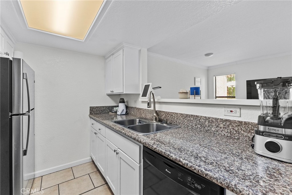 10151 Arrow Route, Unit 6 Rancho Cucamonga, CA 91730 - Photo 6 of 24 a kitchen with sink and refrigerator