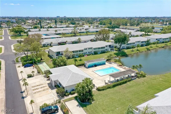 an aerial view of a house with a lake view