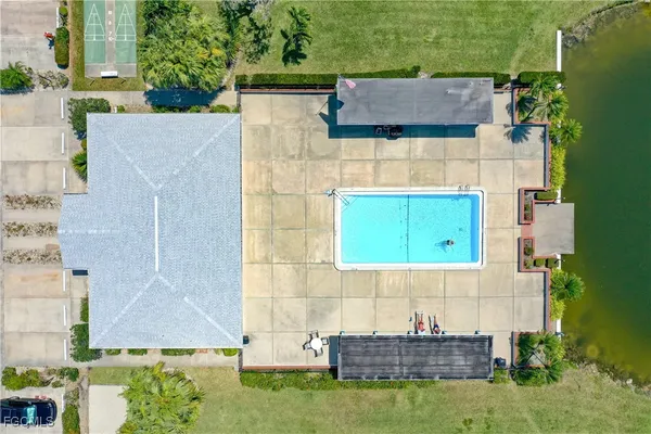 aerial view of a house with a yard